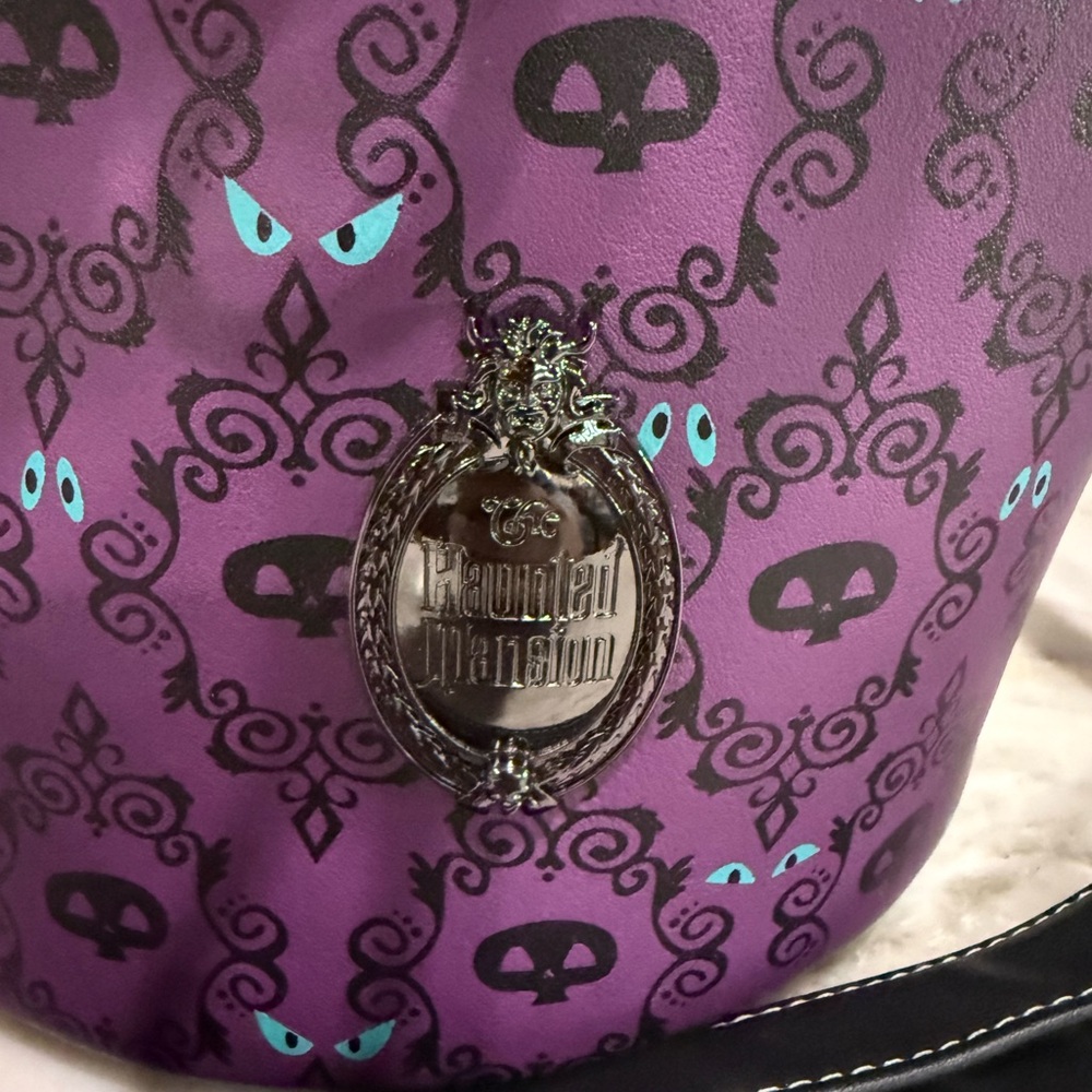 Loungefly Haunted Mansion Purple Patterned Purse with Crest new with tags.